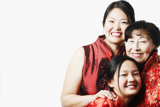 Portrait of a mother with her daughter and granddaughter smiling