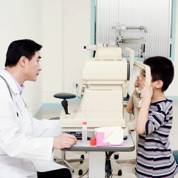 Side profile of an optometrist examining a patient