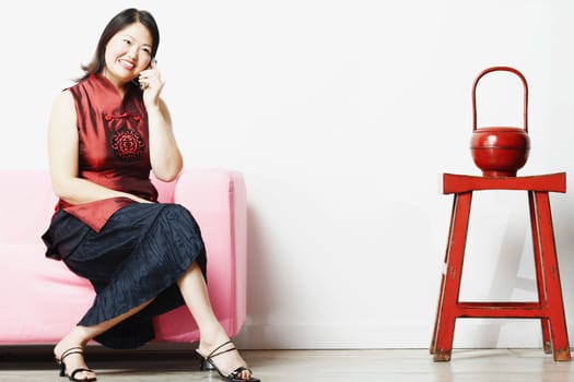 Mid adult woman talking on a mobile phone