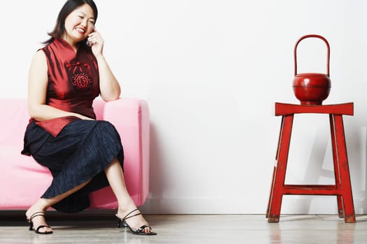 Mid adult woman talking on a mobile phone