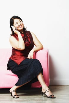 Mid adult woman talking on a mobile phone