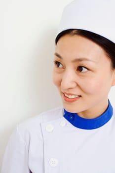 Close-up of a female nurse looking away