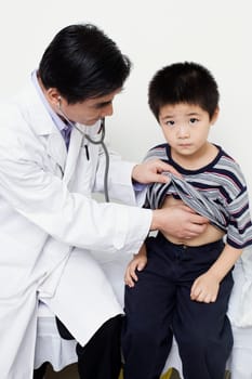Close-up of a male doctor examining a child