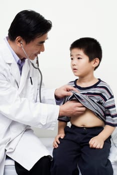 Close-up of a male doctor examining a child