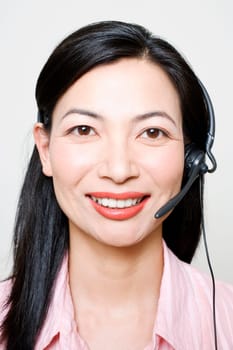 Portrait of a female customer service representative using a headset