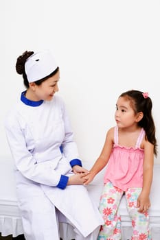 Female nurse holding a girlŽs hand