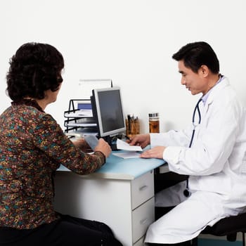 Close-up of a male doctor with a patient in his office