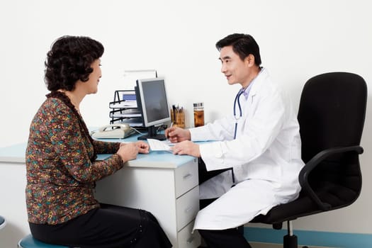 Male doctor talking to a patient