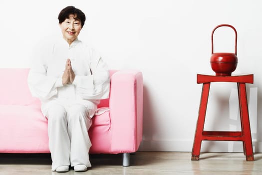Portrait of a mature woman sitting on a couch