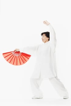Mature woman dancing while holding a parasol