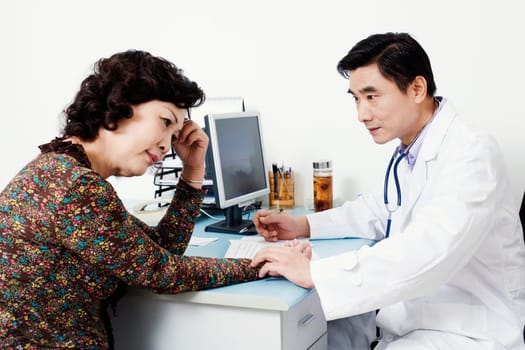 Close-up of a doctor examining a female patient