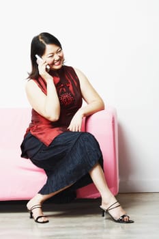 Mid adult woman talking on a mobile phone
