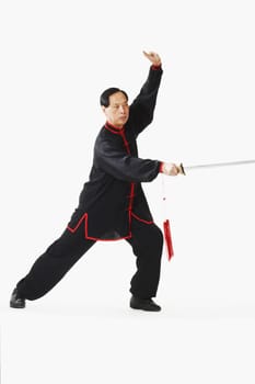 Portrait of a mature man holding a sword