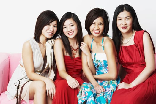 Close-up of four young women sitting together