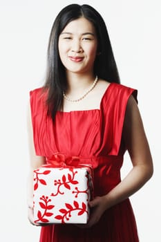 Portrait of a young woman holding a gift