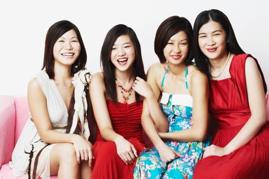 Portrait of four young women sitting together
