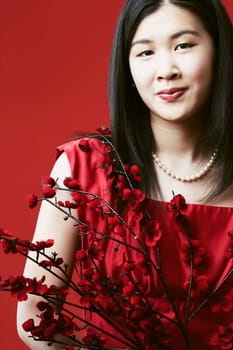 Portrait of a young woman holding flowers