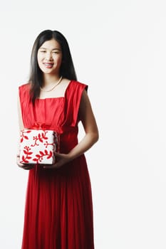 Portrait of a young woman holding a gift