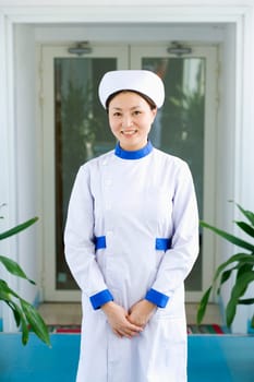 Portrait of a female nurse standing and smiling