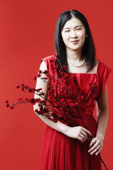 Portrait of a young woman holding flowers