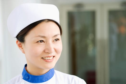 Close-up of a female nurse smiling