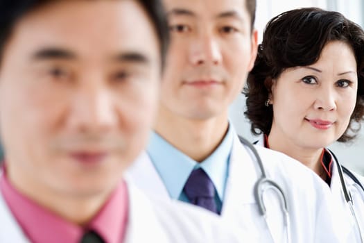 Portrait of two male doctors with a female doctor