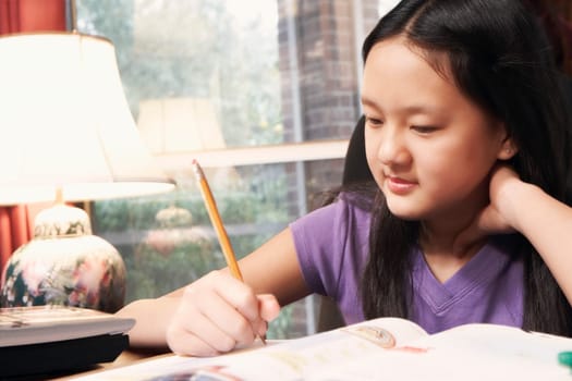 Close-up of a girl writing