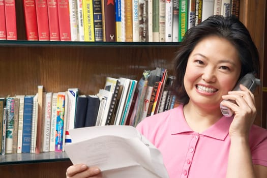 Portrait of a mature woman talking on a cordless telephone