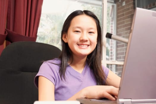 Portrait of a girl using a laptop