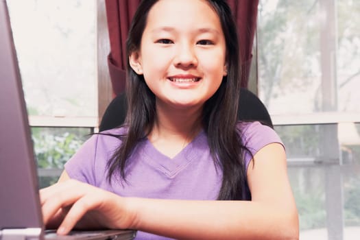 Portrait of a girl using a laptop