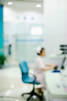 Side profile of a female nurse sitting on a chair
