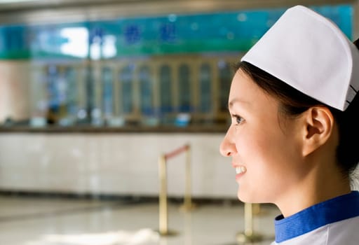 Side profile of a female nurse smiling