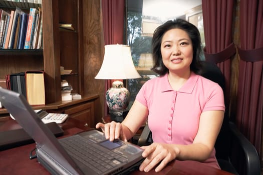 Portrait of a mature woman using a laptop