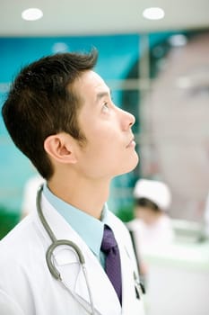 Side profile of a doctor with a stethoscope around his neck