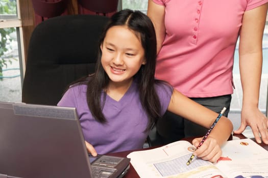 Close-up of a girl using a laptop