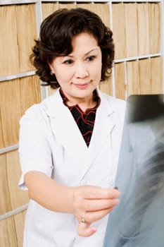 Close-up of a female doctor looking an X-Ray image