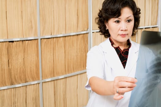Close-up of a female doctor looking an X-Ray image