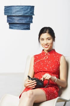 Close-up of a young woman holding a tea kettle