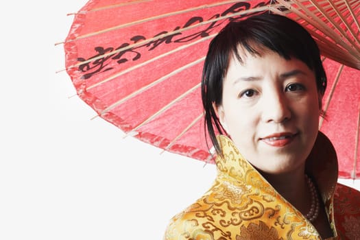 Portrait of a mid adult woman holding a parasol