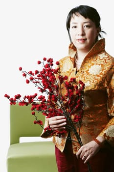 Portrait of a mid adult woman holding flowers