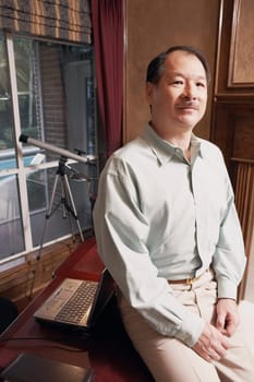 Portrait of a senior man sitting in an office
