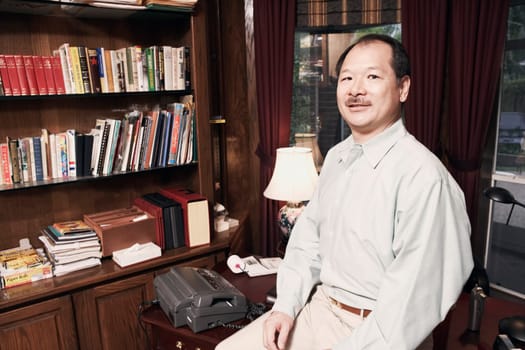 Portrait of a senior man sitting in an office