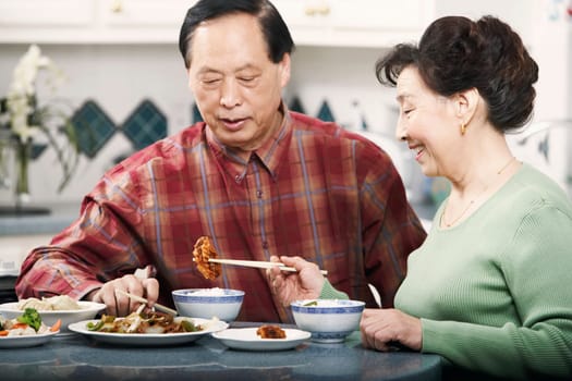 Close-up of a senior couple sitting at a table