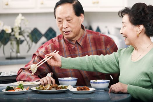 Close-up of a senior couple sitting at a table