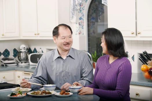 Close-up of a senior man talking to a mature woman