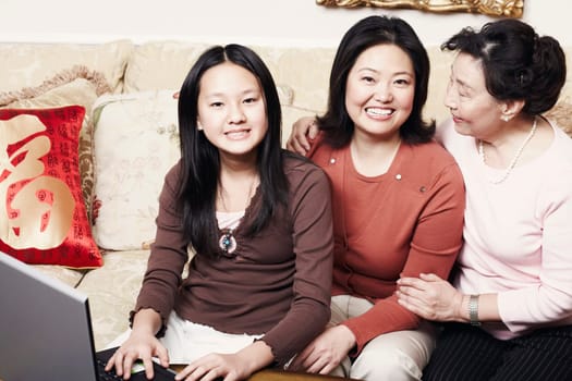 Portrait of a girl sitting with her mother and her grandmother