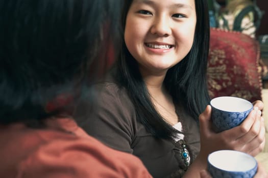 Close-up of a girl holding a tea cup