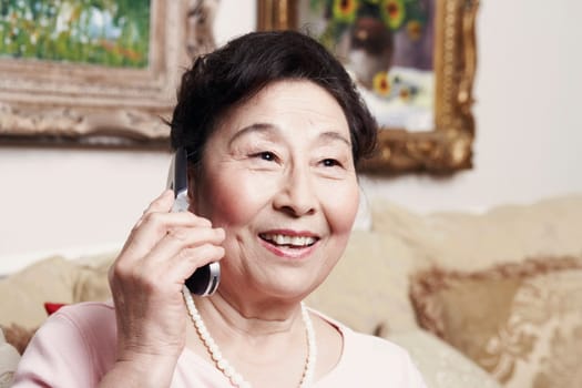 Close-up of a senior woman talking on a mobile phone