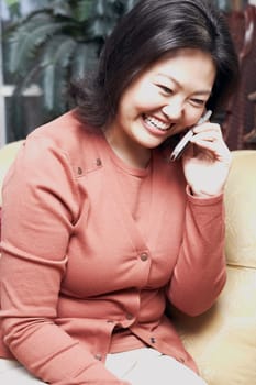 Close-up of a mature woman using a mobile phone