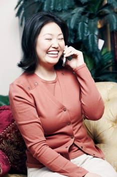 Close-up of a mature woman using a mobile phone